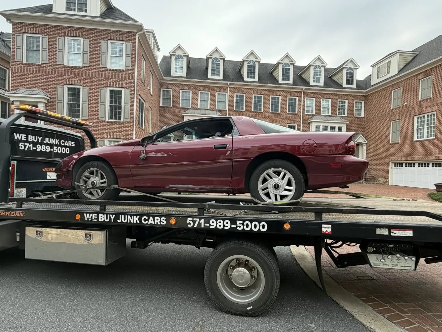 Camaro loaded for junk car removal in an Alexandria condo community