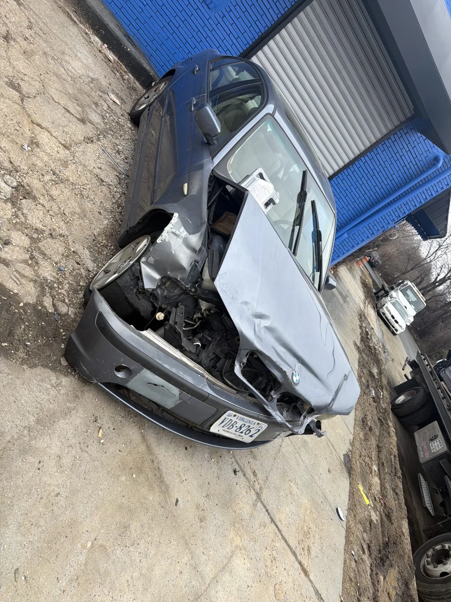 Damaged BMW being picked up by Dalo Auto Recycling near Occoquan, VA
