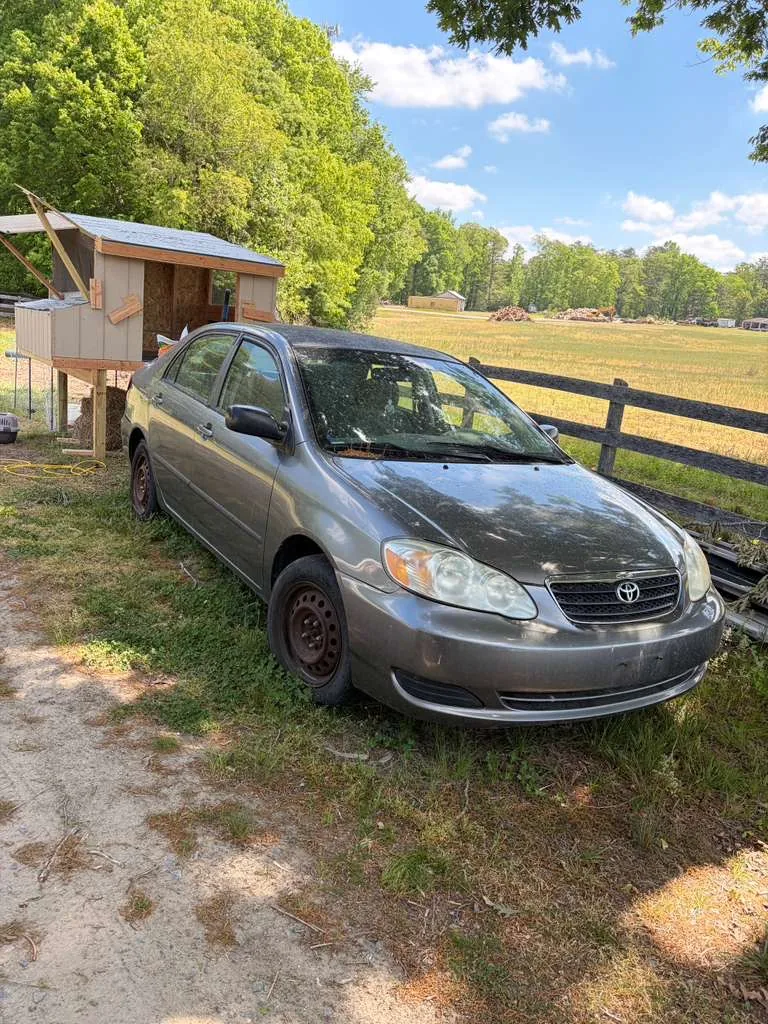 Older Toyota Corolla sitting unused before junk car removal in Woodbridge, VA